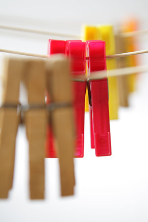 clothespins on white background, close up