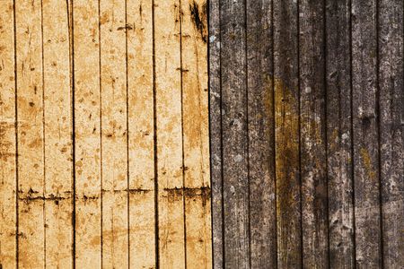 yellow wood texture with weathered planks, rough backgroundの写真素材