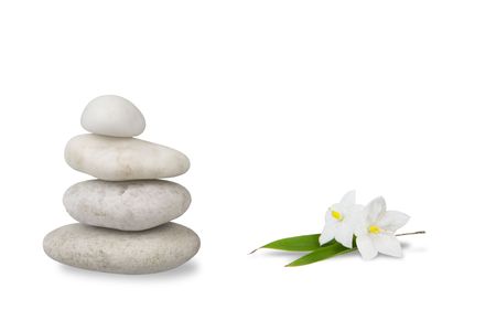 wellness still life, pebbles stacked, with jasmine and reflection high key studio shotの写真素材