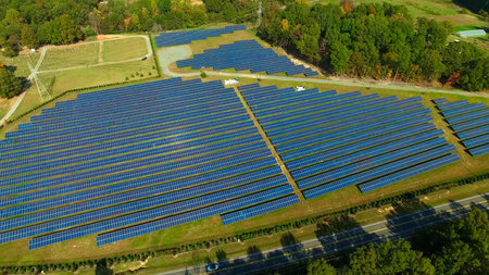 aerial view of solar panels on a sunny day. power farm producing clean energy