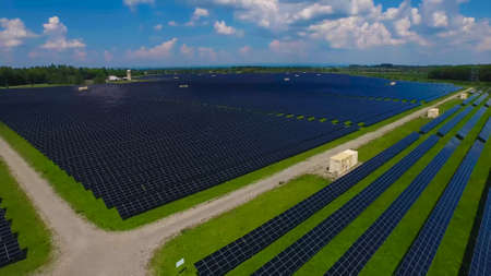 aerial view of solar panels on a sunny day. power farm producing clean energyの写真素材