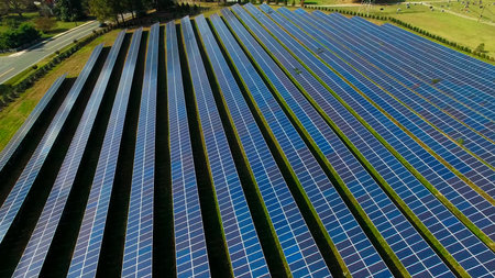 aerial view of solar panels on a sunny day. power farm producing clean energy