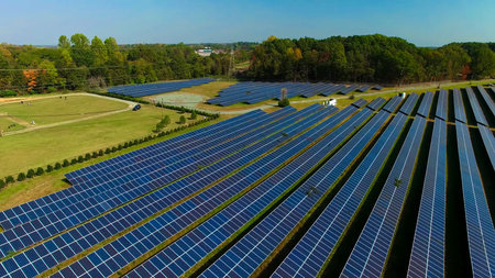 aerial view of solar panels on a sunny day. power farm producing clean energy