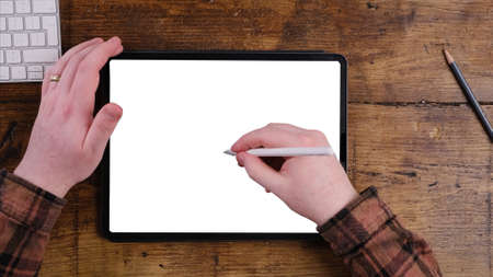 using digital touchscreen tablet with stylus pen and smart keyboardの写真素材