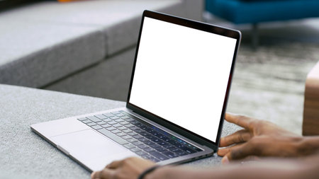 laptop with tilted back white monitor mockup