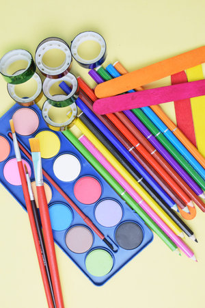 Colorful flat lay background with craft supplies on the way back to school