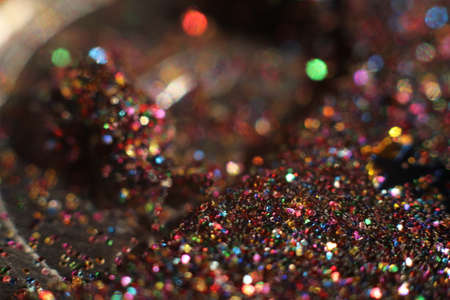 background of abstract glitter lights. gold, blue red, pink,and black. de focusedの写真素材