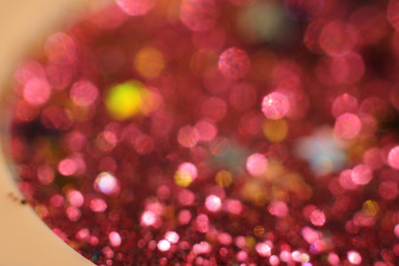 background of abstract glitter lights. gold, blue red, pink,and black. de focused