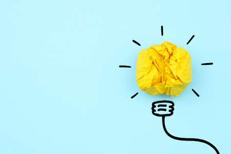 Creative idea, Inspiration, New idea and Innovation concept with Crumpled Paper light bulb on white backgroundの写真素材