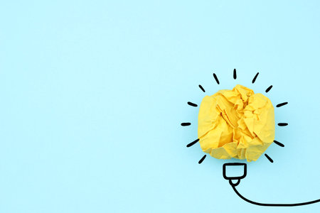Creative idea, Inspiration, New idea and Innovation concept with Crumpled Paper light bulb on white...