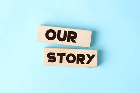 OUR STORY words on wooden cubic building block . Business with history, conceptの写真素材