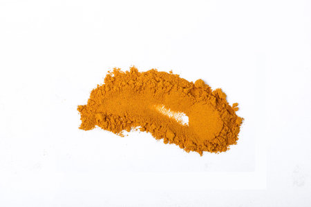 Turmeric powder on black background