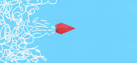 Business for solution concept Red paper plane on blue backgroundの写真素材