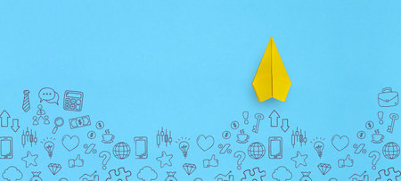 Paper plane and business strategy on blue background, Business success, innovation and solution concept with copy spaceの写真素材