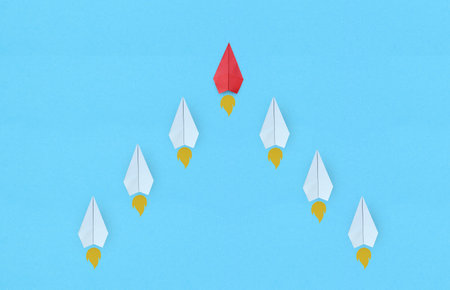 Successful business, innovative and solution concepts. Group of white paper plane in one direction...