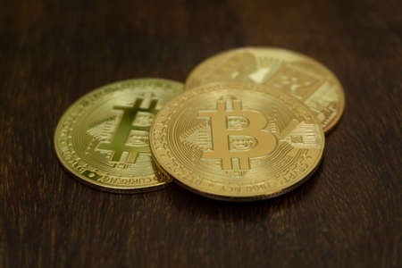 Close up golden coin with bitcoin symbol isolated on white backgroundの写真素材