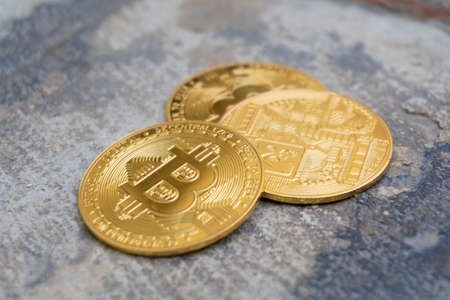 Close up golden coin with bitcoin symbol isolated on white backgroundの写真素材