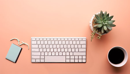 Office desk table with computer keyboard, coffee cup and succulent.の素材