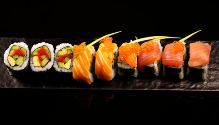 Sushi rolls on a black background. Sushi menu. Japanese foodの素材