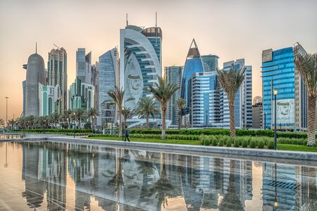Doha, Qatar-March 15,2018: Doha, Qatar Skyline daylight view from Sheraton park with reflection in the water HDR imageのeditorial素材