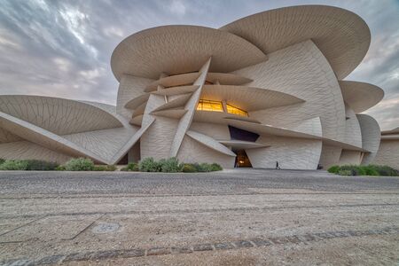 Doha, Qatar-November 16,2019 :National Museum of Qatar (Desert rose) panoramic  view at sunsetのeditorial素材