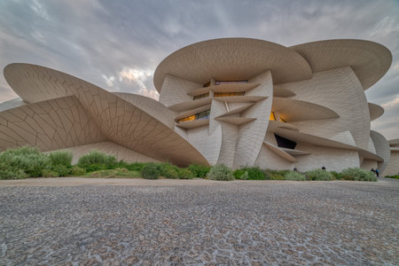 Doha, Qatar-November 16,2019 :National Museum of Qatar (Desert rose) panoramic  view at sunset