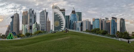 Doha, Qatar-November 18,2019: Doha, Qatar  Skyline daylight view from Sheraton park  with clouds in sky in backgroundのeditorial素材
