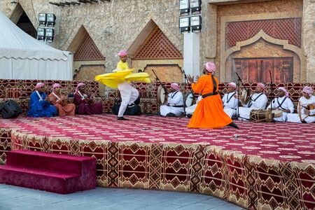 Doha,Qatar-January 20,2017:Traditional Arabic folklore dance in Souk Waqif spring festivalのeditorial素材