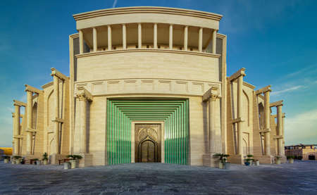The amphitheater in Katara Cultural Village,Doha Qatar panoramic view in daylight from outside showing the main gate with clouds in the skyのeditorial素材