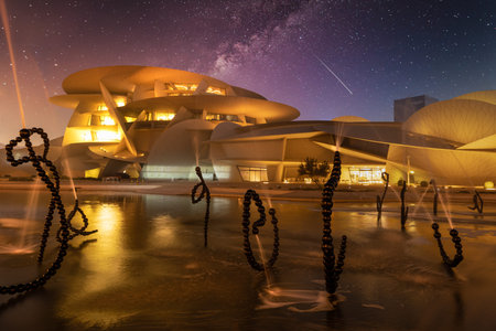 National Museum of Qatar (Desert rose) exterior  night view with fountain in foreground