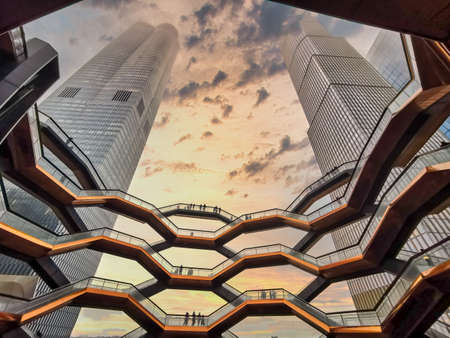 Vessel  New York city at sunset low angle internal view with surrounding skyscrapers and clouds in skyのeditorial素材