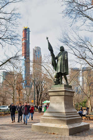 Christopher Columbus Statue (by  Jeronimo Suol)  in Central park New York city daylight view with trees and clouds in skyのeditorial素材