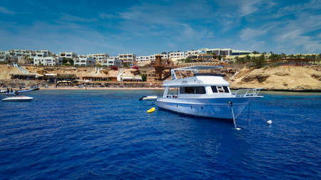 Sharm El Sheikh (Egypt) marina daylight panoramic view in summer with yachts in water, hotels in background and clouds in the skyのeditorial素材