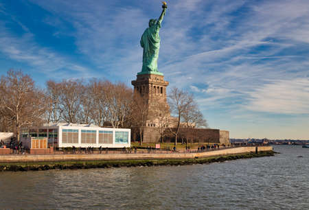 The Statue of Liberty in New York City USA daylight  view  from the back  in Liberty Island with clouds in the  sky  in backgroundのeditorial素材
