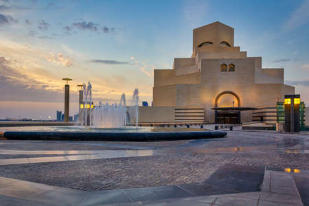 Museum of Islamic Art , Doha, Qatar  exterior view at sunset with clouds in the sky in the backgroundのeditorial素材