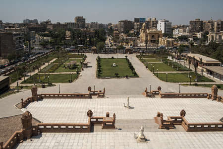 Heliopolis Cairo , Egypt  from the top of Baron Empain Palace  daylight  view showing the palace garden, El-Orouba street with cars and people movingのeditorial素材