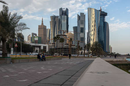 Doha corniche daylight view with skylines and clouds in sky in backgroundのeditorial素材