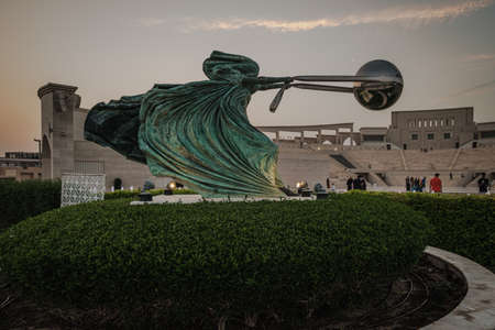 Katara Cultural village in Doha, Qatar with Force of Nature 2 statue in foreground and the Amphitheater in the background at sunsetのeditorial素材