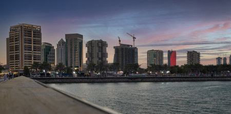 Lusail marina  in Lusail city, Qatar at sunset with Yachts and boats ,Lusail skyline and clouds in the sky in  in backgroundのeditorial素材
