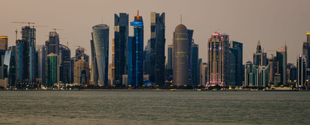 Doha Qatar skyline in the afternoon showing skyscrapers of West bay area in the background and the...