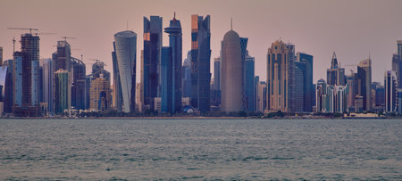 Doha Qatar skyline in the afternoon showing skyscrapers of West bay area in the background and the Arabic gulf in foregroundのeditorial素材