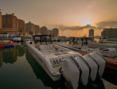 The pearl Marina in Porto Arabia , Doha Qatar daylight view with Yachts in foreground, buildings and clouds in the sky in backgroundのeditorial素材