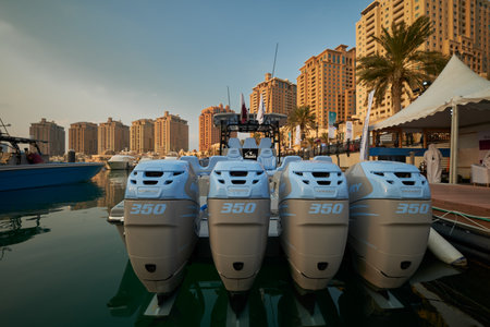 The pearl Marina in Porto Arabia , Doha Qatar daylight view with Yachts in foreground, buildings and clouds in the sky in backgroundのeditorial素材