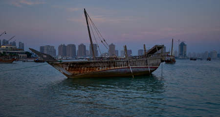 Katara eleventh traditional dhow festival in Doha Qatar sunset shot showing  dhows with Qatar Flag in Arabic gulfの写真素材