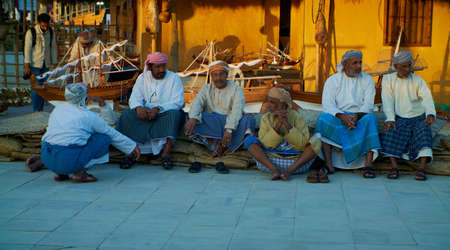 Group of Traditional Arabic fishermen sitting in Katara cultural village in Doha, Qatar daylight view during Katara eleventh traditional dhow festivalのeditorial素材