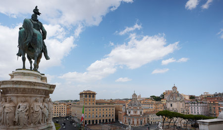 Historic Piazza Venezia and Ornate Domes in the Heart of Romeの写真素材