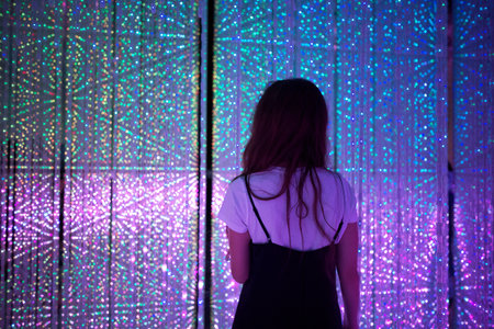 Woman exploring luminous light installation