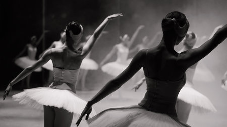 Ballerinas in white tutus, view from backstage. Black and white photos