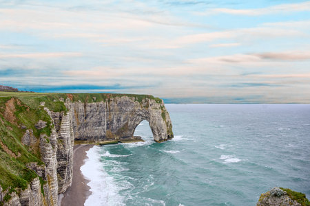 Aerial view of Etretat cliff arch and ocean waves in Normandyの写真素材