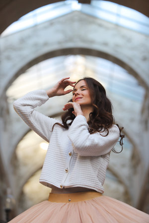 Smiling ballet dancer in tutu and sweater outdoorsの写真素材